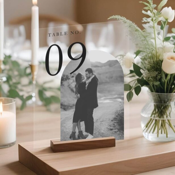 Capture your love story in a modern and elegant way with our breathtaking acrylic table number sign. Featuring a minimalistic design, this personalized masterpiece allows you to showcase your black and white couples photo with grace and style. Elevate your wedding décor to new heights and leave your guests in awe. Get ready to turn heads and create cherished memories with our stunning modern arch couple's photo wedding acrylic table number sign.