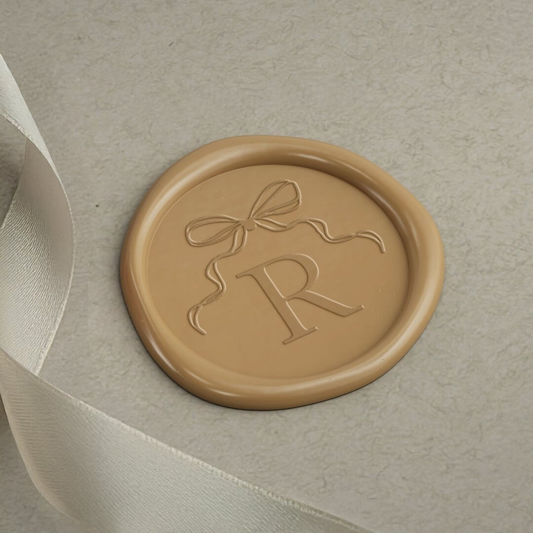 https://www.zazzle.com/elegant_vintage_bow_ribbon_monogram_wedding_wax_seal_sticker-256173590825969503
