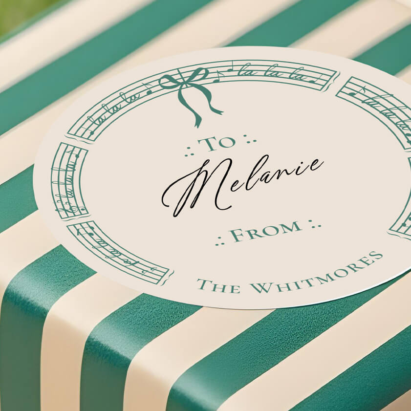 This collection is thoughtfully designed to offer a cohesive holiday look from your cards to your gifts. Featuring holiday cards, matching envelopes, return address labels, keepsake ornaments, mugs, gift wrap, ribbons, tissue paper, tags, and stickers, every detail works together harmoniously. With its elegant sheet music accents and playful holiday bows, this collection blends vintage charm with modern style, creating the perfect mix of nostalgia and fresh design. Personalization options let you add your family name, year, or photo to make each piece a true keepsake.